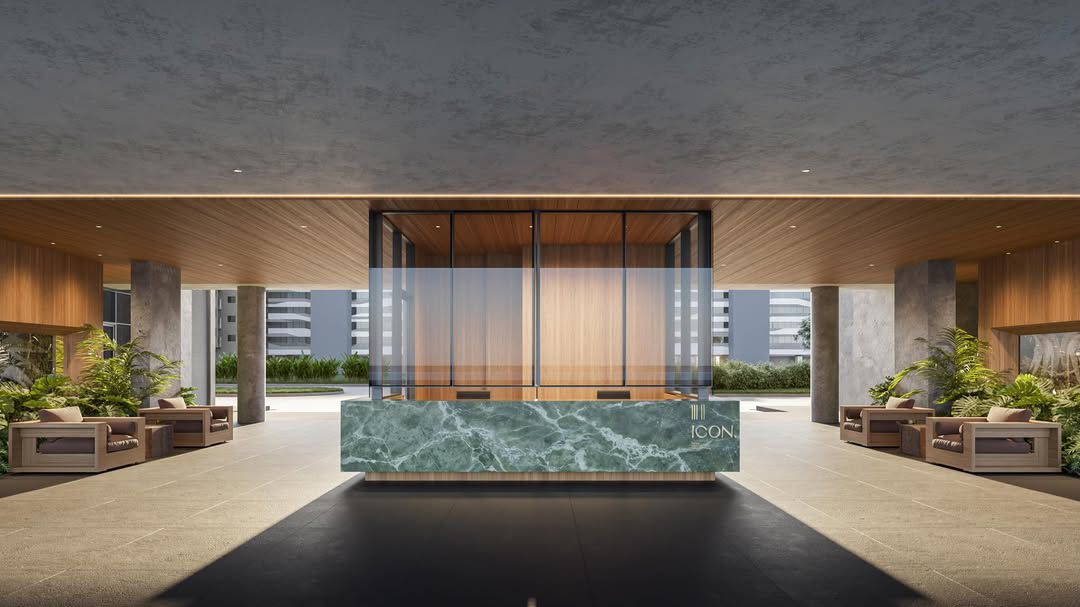 Lobby do Icon com recepção em mármore verde e marcenaria